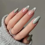 someone_s-hands-with-sage-green-geometric-french-tips-nails-french-tip-nude-glitter-elegant-pink-glitter-nude-glitter-classy-nail_600x600