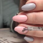 Trendy manicure design on a beautiful textural background.