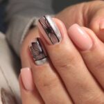 Amazing natural nails. Women's hands with clean manicure. Gel polish applied.