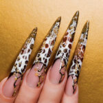 Beautiful nails on yellow background.