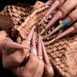 glamour concept, amazing long artificial nails with writing design.art concept.